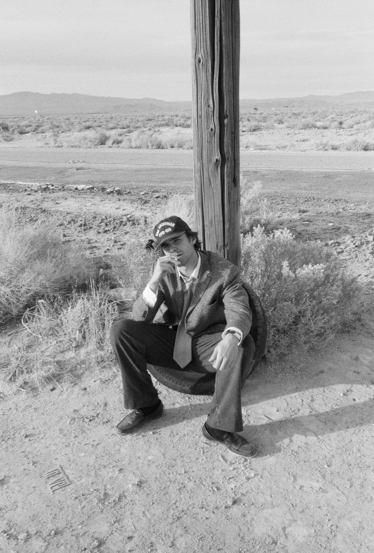 Joseph Bortoli seated in the desert